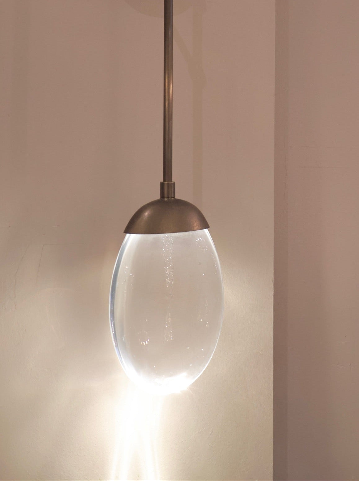 CELESTIAL PEBBLE PENDANT - rod/antique brass