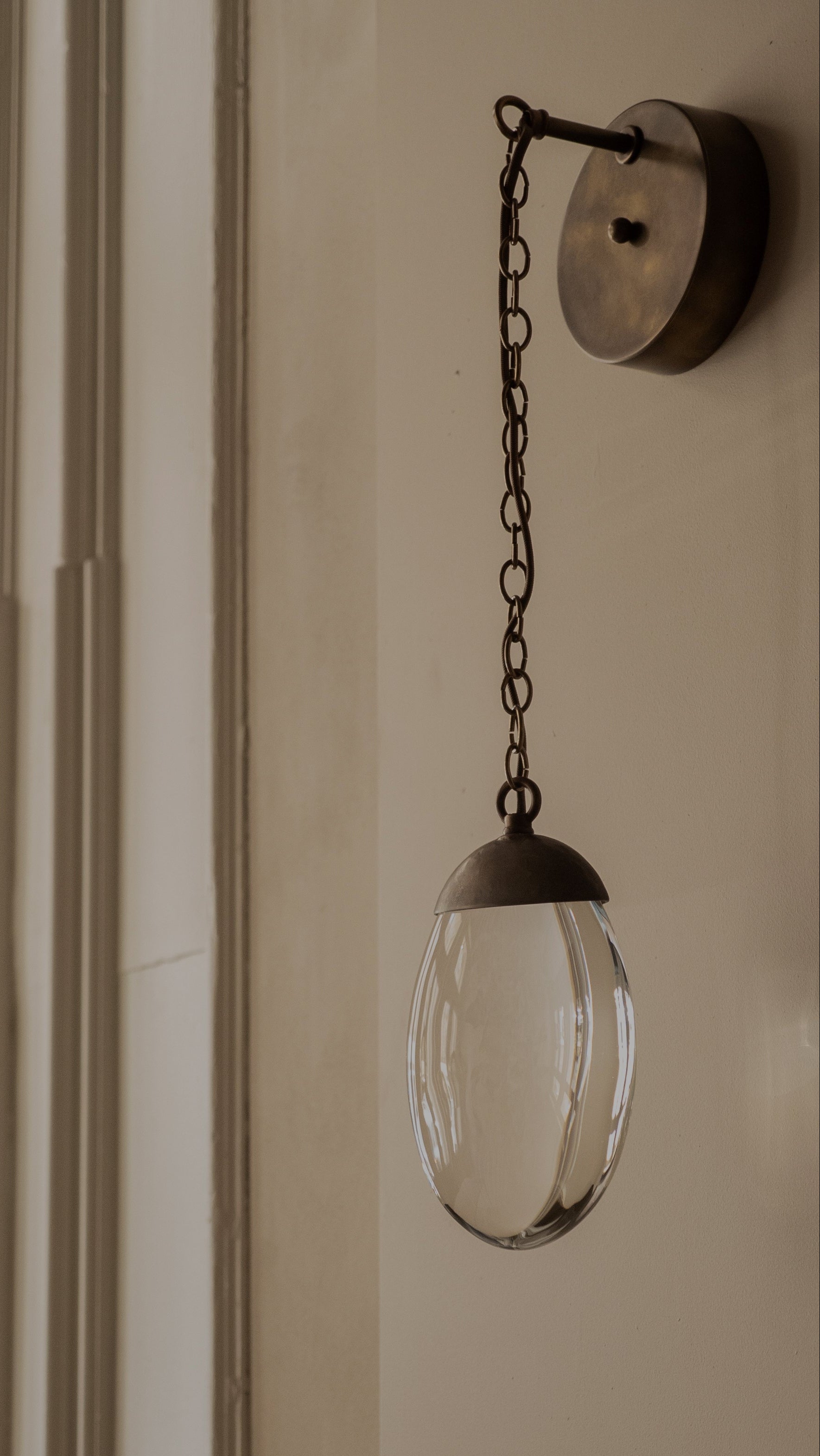 CELESTIAL PEBBLE WALL LIGHT - chain/antique brass